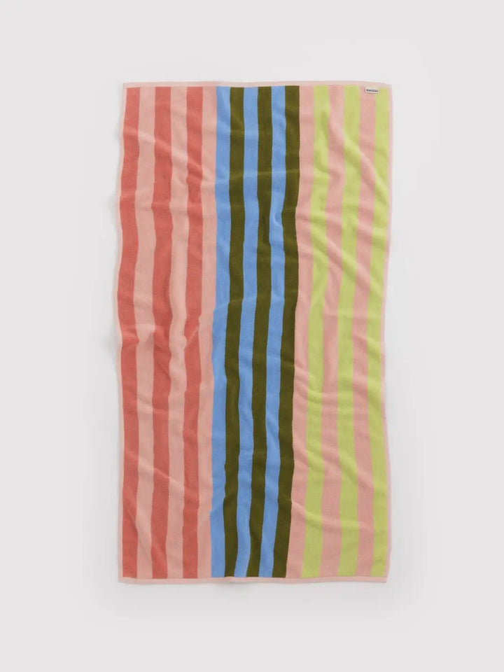 A full-length view of the Baggu Bath Towel in Sherbet Stripe laid flat, showcasing its vibrant vertical stripes in lime, pink, blue, and olive | Twentyseven Toronto