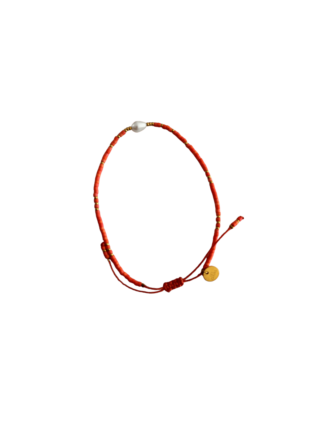 Bracelet with red cord, small red and gold beads and single white pearl with gold charm on a transparent background | Twentyseven Toronto