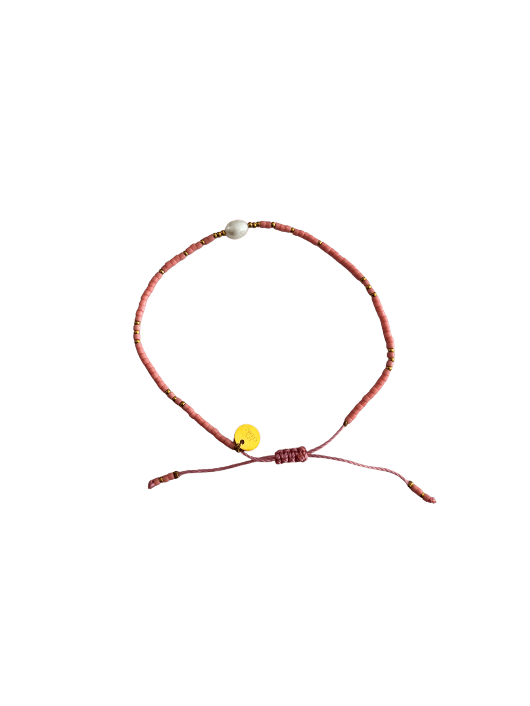 Bracelet with pink cord, small pink and gold beads and single white pearl on a transparent background | Twentyseven Toronto