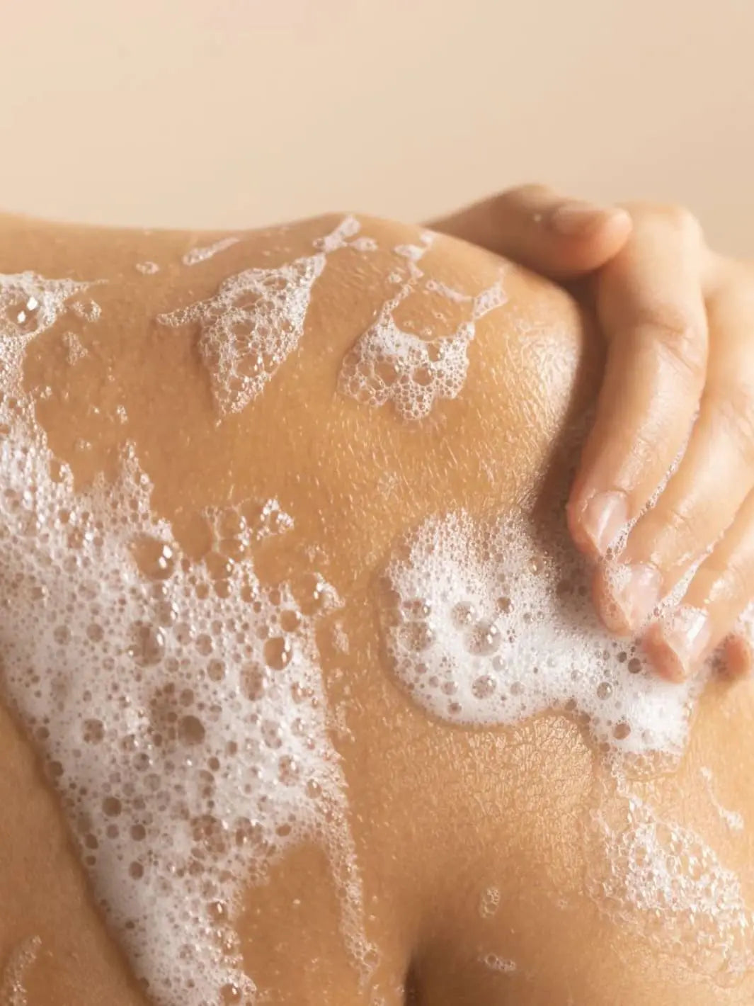 Beauty from Bees Body Wash | Twentyseven Toronto | Foamy Beauty from Bees Body Wash lather on a person's shoulder and arm