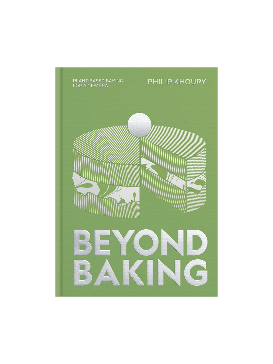 Front cover of Beyond Baking: Plant-Based Baking for a New Era by Philip Khoury, featuring a green background with a silver-foiled graphic of a layered cake and the title in large, bold silver letters | Twentyseven Toronto