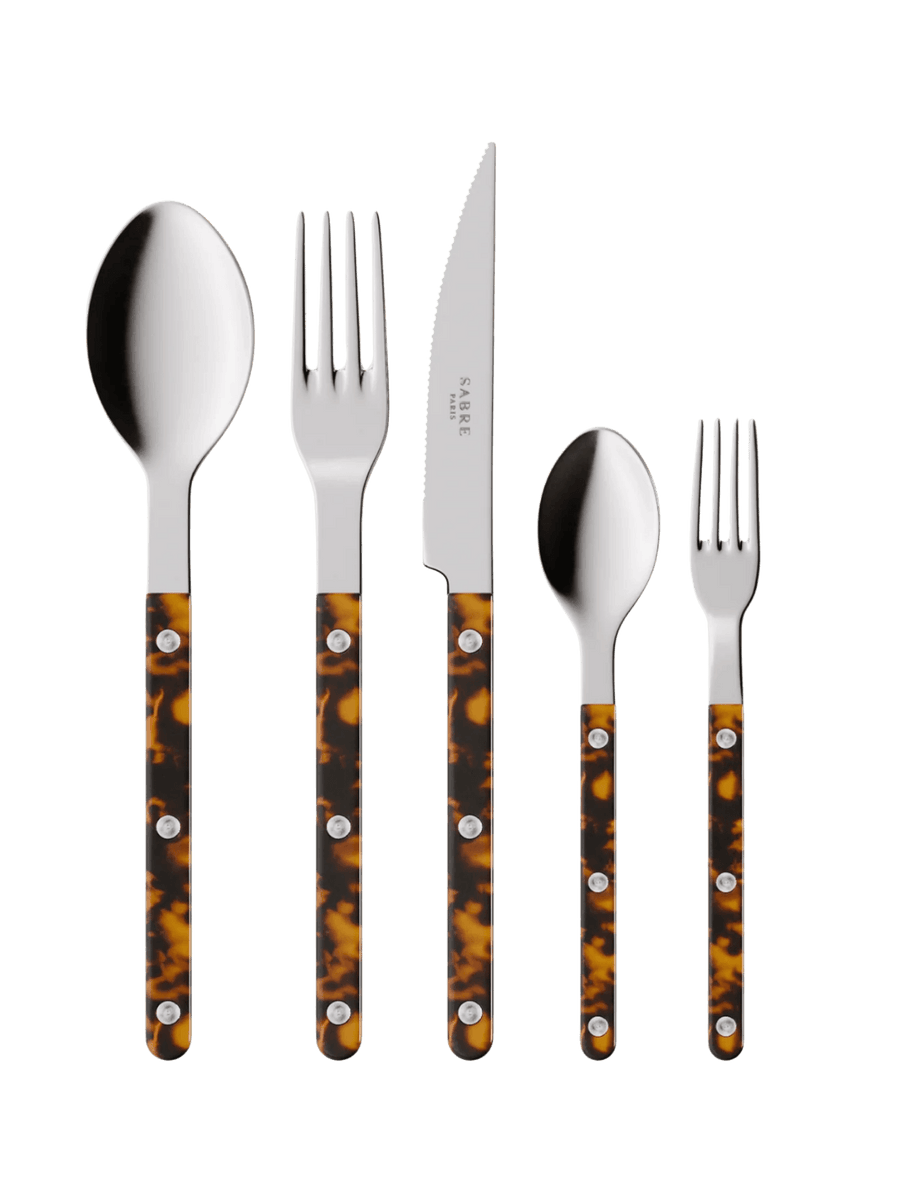 The complete Sabre Paris Bistrot Solid Shiny 5 Piece Cutlery Set in Faux Tortoise including a soup spoon, a dinner fork, a serrated dinner knife blade, a teaspoon and a small fork | Twentyseven Toronto