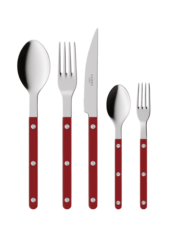 The complete Sabre Paris Bistrot Solid Shiny 5 Piece Cutlery Set in Burgundy including a soup spoon, a dinner fork, a serrated dinner knife blade, a teaspoon and a small fork | Twentyseven Toronto