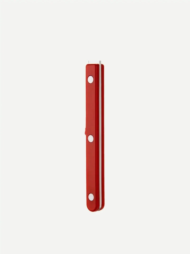 Side view of a handle from the Sabre Paris Bistrot Solid Shiny 5 Piece Cutlery Set in Burgundy, highlighting the deep red finish and the triple-rivet stainless steel detail | Twentyseven Toronto