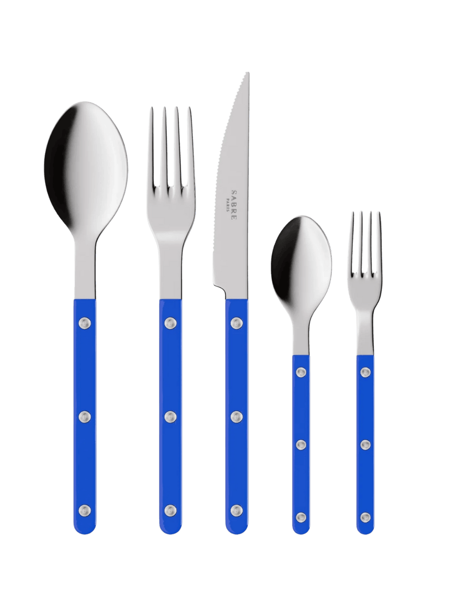 The complete Sabre Paris Bistrot Solid Shiny 5 Piece Cutlery Set in Lapis Blue including a soup spoon, a dinner fork, a serrated dinner knife blade, a teaspoon and a small fork | Twentyseven Toronto