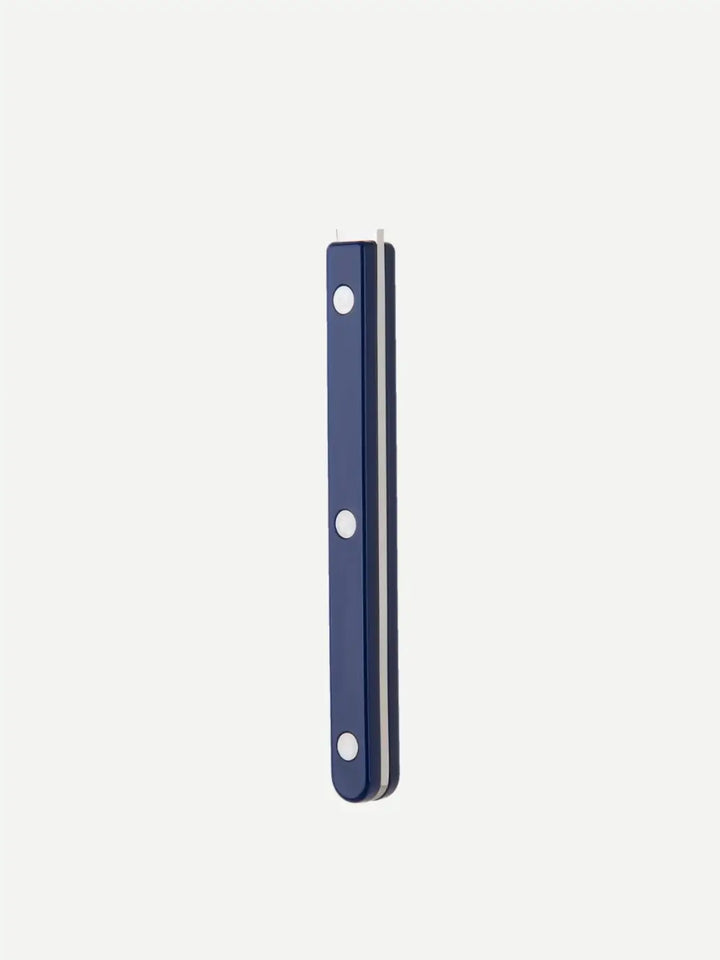 Side view of a handle from the Sabre Paris Bistrot Solid Shiny 5 Piece Cutlery Set in Navy Blue, highlighting the deep blue finish and the triple-rivet stainless steel detail | Twentyseven Toronto