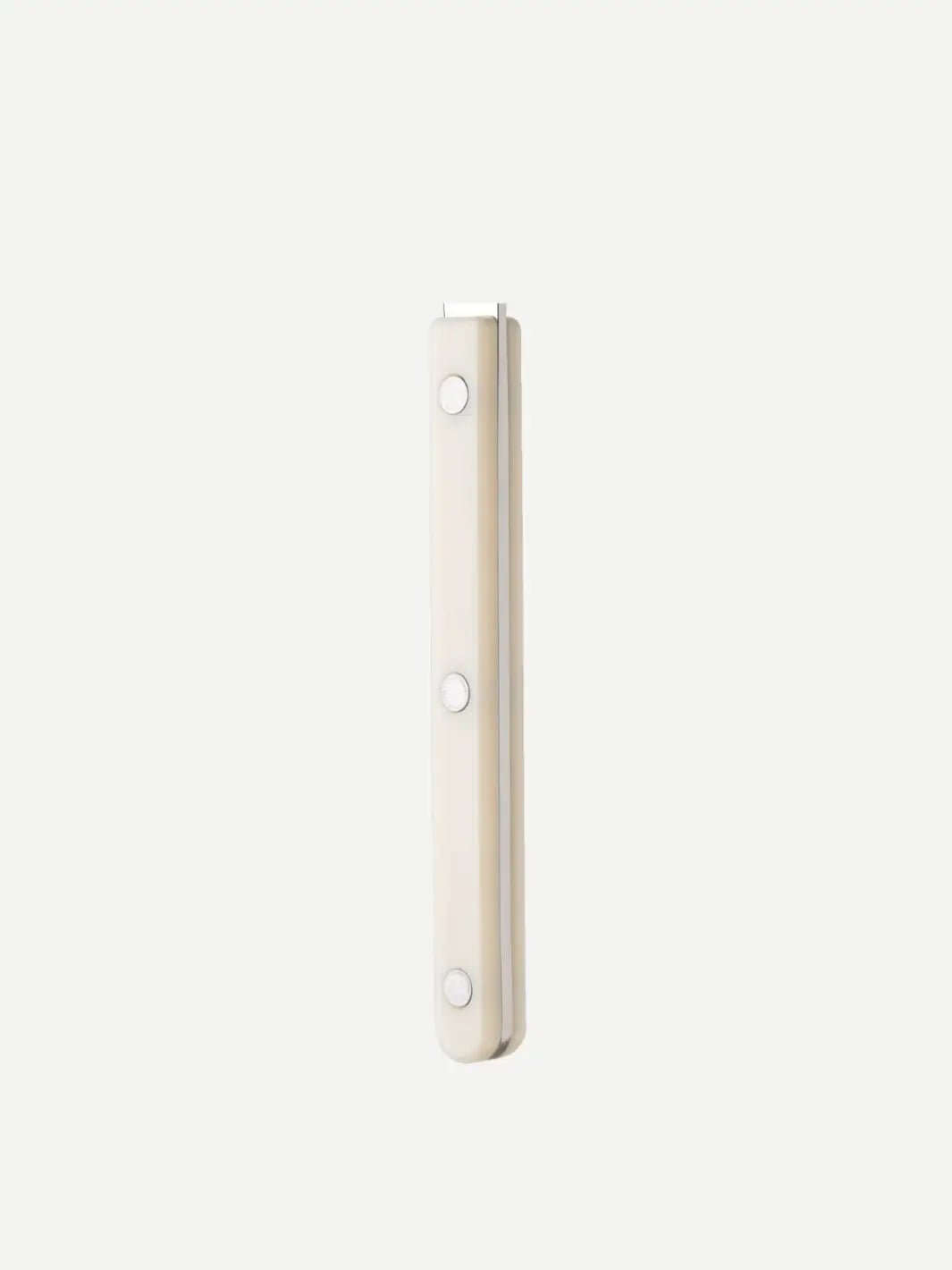 Side view shot of the Sabre Paris Shiny Bistrot Solid Bottle Opener in Ivory against a plain white background highlighting triple-riveted burgundy handle | Twentyseven Toronto