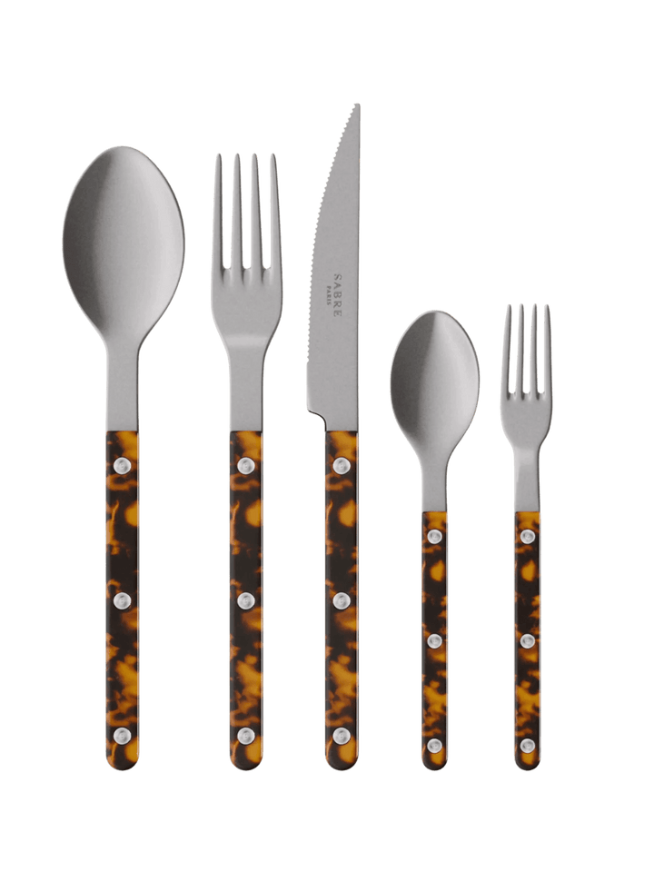 The complete Sabre Paris Bistrot Vintage Finish 5 Piece Cutlery Set in Faux Tortoise including a soup spoon, a dinner fork, a serrated dinner knife blade, a teaspoon and a small fork | Twentyseven Toronto