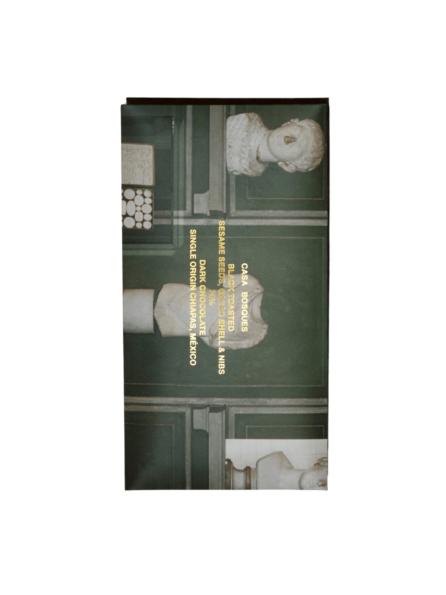 Premium Black Toasted Sesame Seeds, Cacao Shell & Nibs Chocolate Bar from Casa Bosques is shown in its artistic, museum-inspired paper packaging featuring classical busts | Twentyseven Toronto