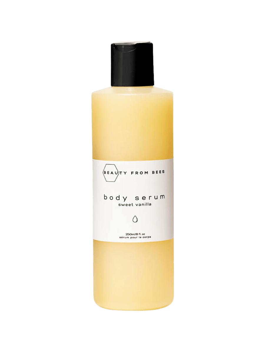 Body serum bottle in Sweet Vanilla by Beauty from Bees with a black cap on a transparent background | Twentyseven Toronto