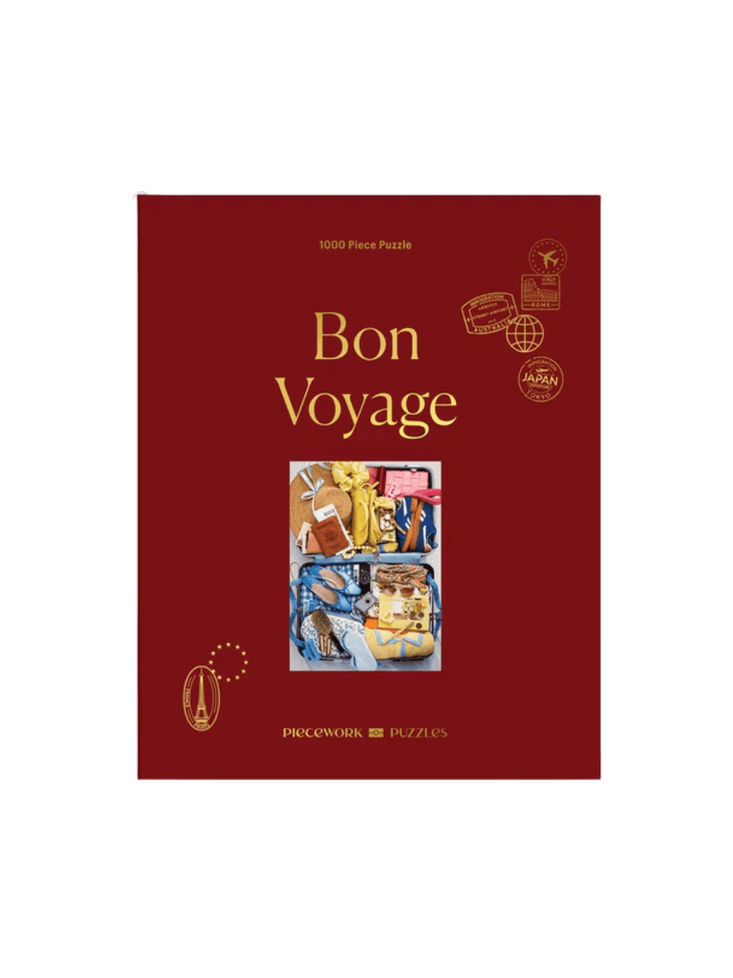 The Piecework Puzzles Bon Voyage 1000 Piece Puzzle features its classic dark red box cover | Twentyseven Toronto
