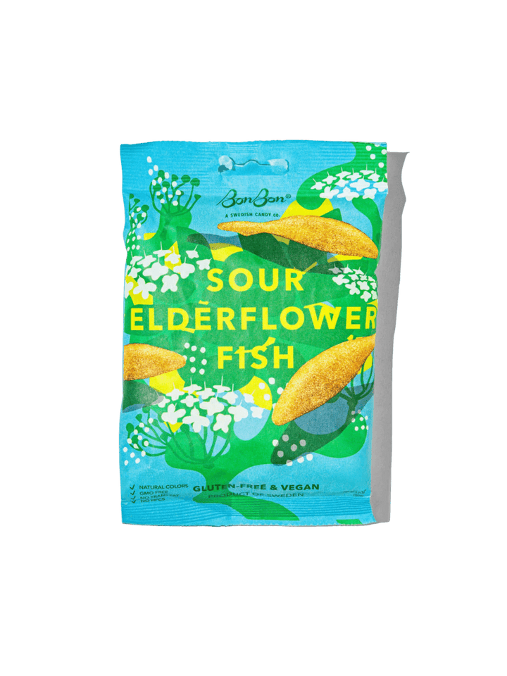 A bag of BonBon's Sour Elderflower Fish gummy candies featuring bright blue-green packaging decorated with illustrations of white elderflower blossoms, green leaves, and yellow-orange fish | Twentyseven Toronto