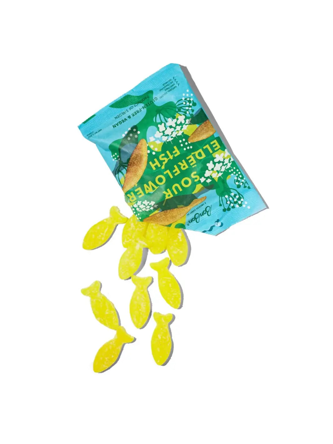 A bag of BonBon Swedish Candy Sour Elderflower Fish with several yellow fish-shaped gummies spilled out, set against a plain white background | Twentyseven Toronto