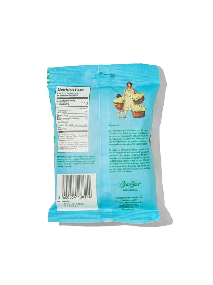 The back of a light blue BonBon Swedish Candy Sour Elderflower Fish gummies showing the nutrition facts panel, barcode, and product description text on a white background | Twentyseven Toronto