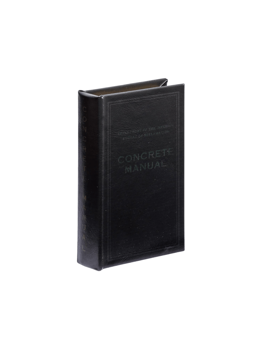 The Book Box - Concrete Manual BK from Puebco replicates a vintage technical manual with its black leatherette texture and dark debossed lettering | Twentyseven Toronto