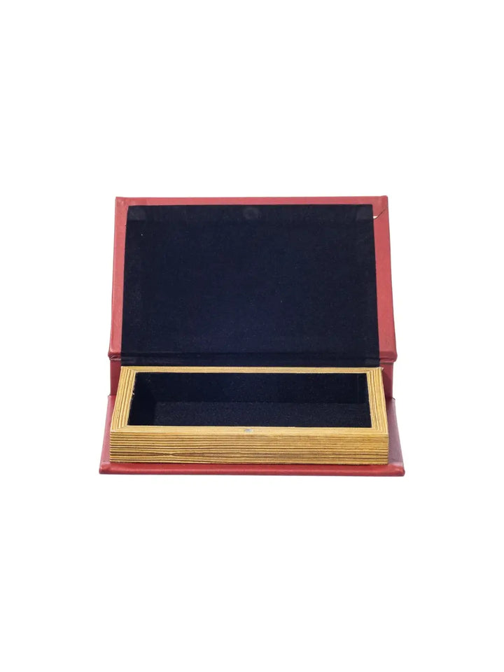 The Book Box - Fiberglass Plastics from Puebco is opened to reveal a hollow, black velvet-lined storage compartment disguised by gold-toned faux paper edges | Twentyseven Toronto