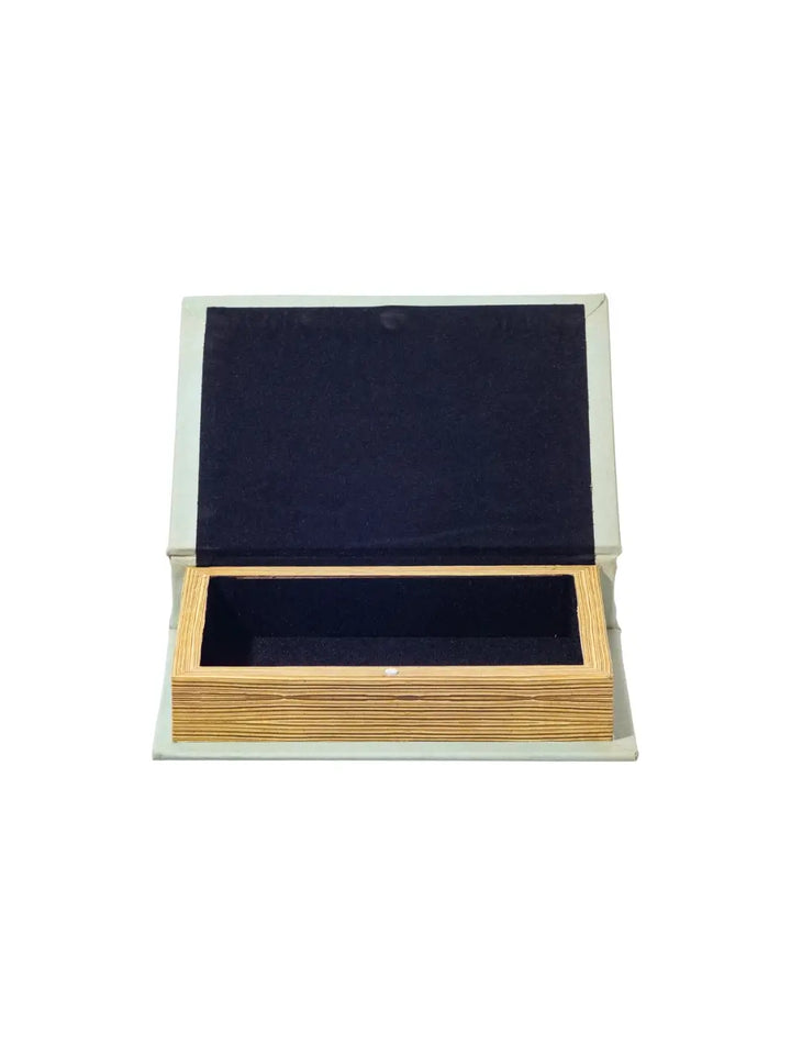 The Book Box - Metals and Alloys from Puebco is shown wide open, revealing a hollow wooden storage compartment lined with dark fabric | Twentyseven Toronto