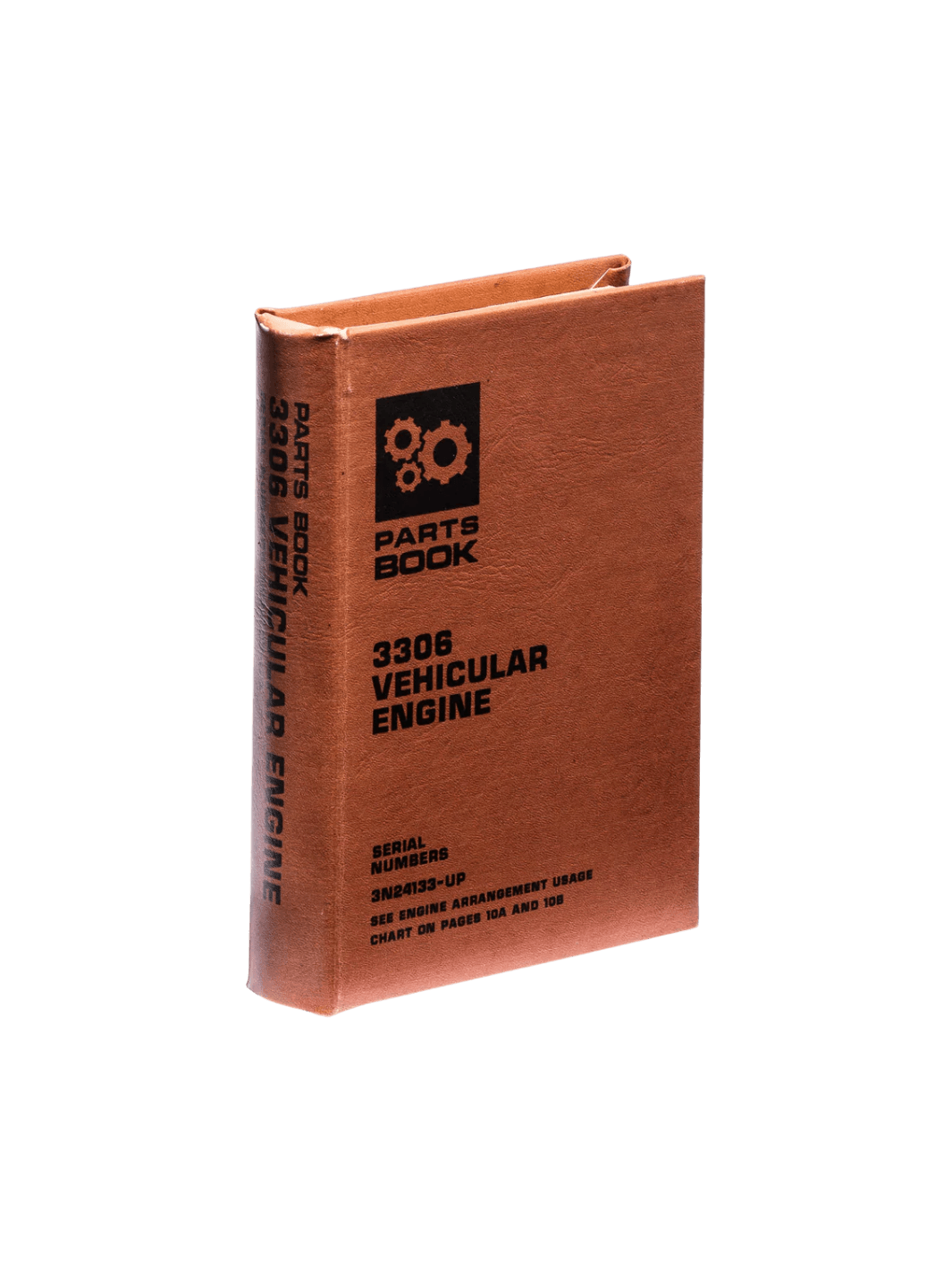 Brown Book Box - Vehicular Engine from Puebco stands upright, showcasing its vintage gear graphic and technical text printed on the front and spine | Twentyseven Toronto
