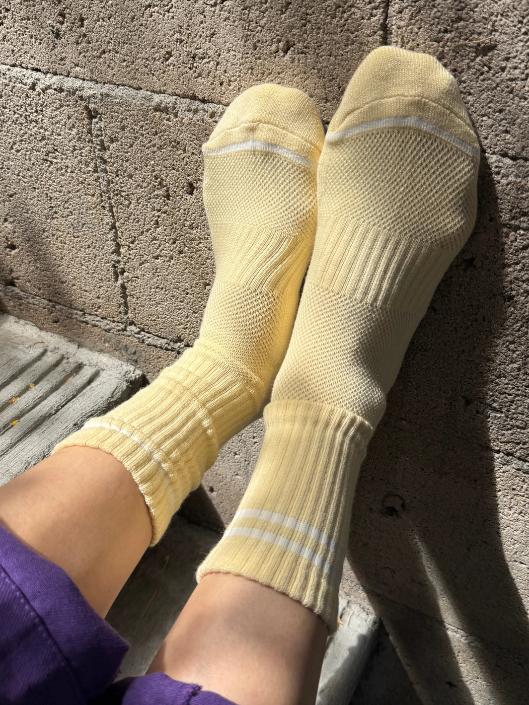 Le Bon Shoppe Boyfriend Socks in Lemonade with white contrast stripes, shown in a sunlit lifestyle view | Twentyseven Toronto