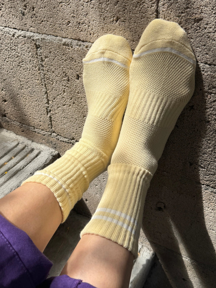 Le Bon Shoppe Boyfriend Socks in Lemonade with white contrast stripes, shown in a sunlit lifestyle view | Twentyseven Toronto