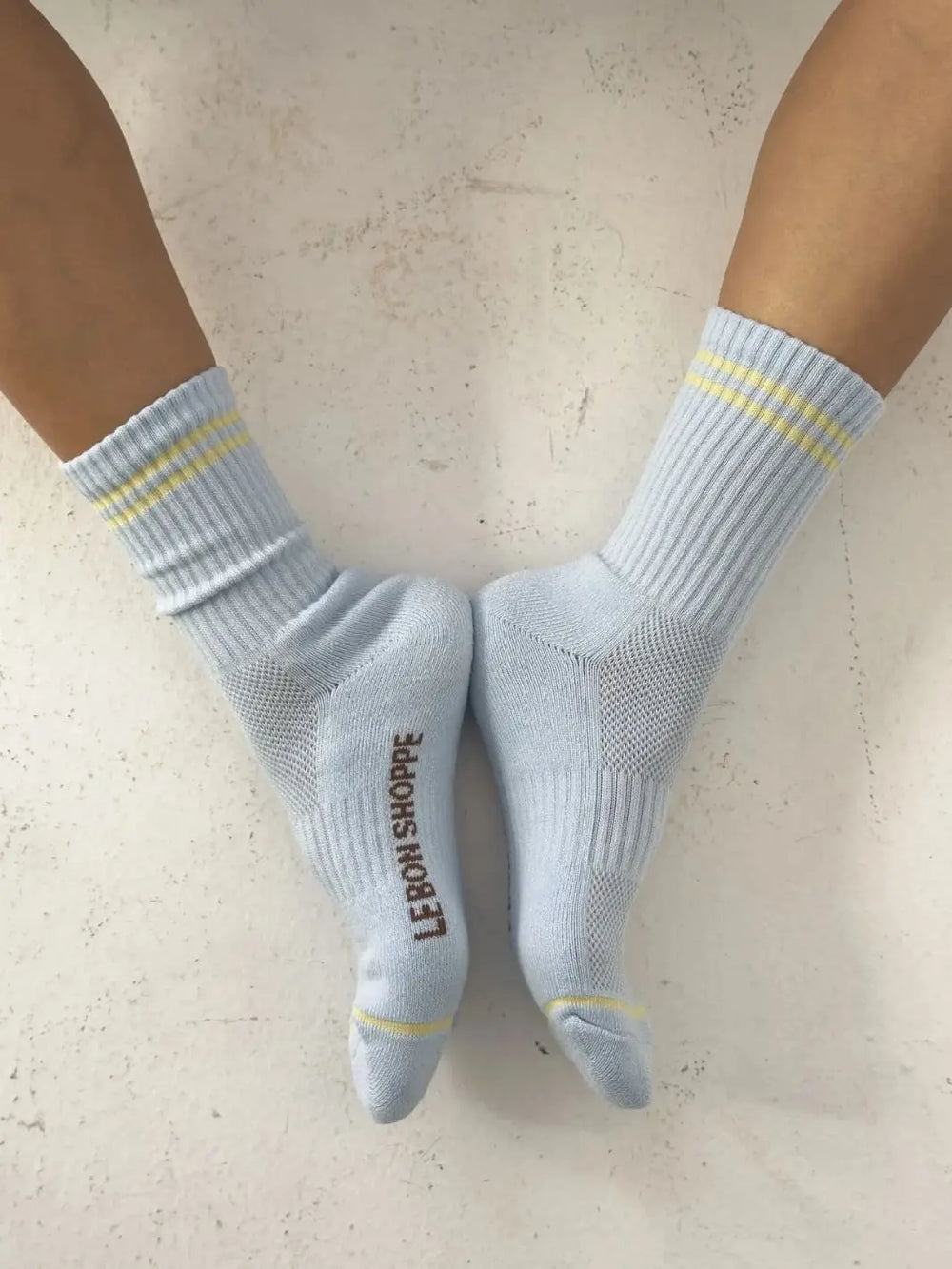 Light blue with yellow stripes Boyfriend Socks in 'Pastel Sky' worn by a person from Le Bon Shoppe | Twentyseven Toronto