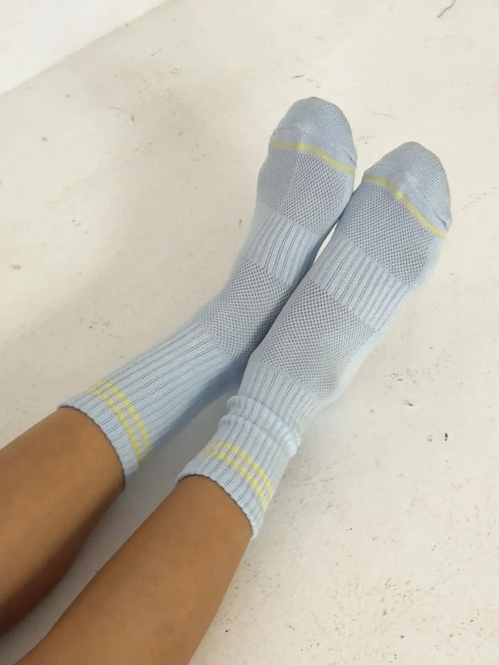 Light blue with yellow stripes Boyfriend Socks in 'Pastel Sky' worn by a person from Le Bon Shoppe on a light background | Twentyseven Toronto