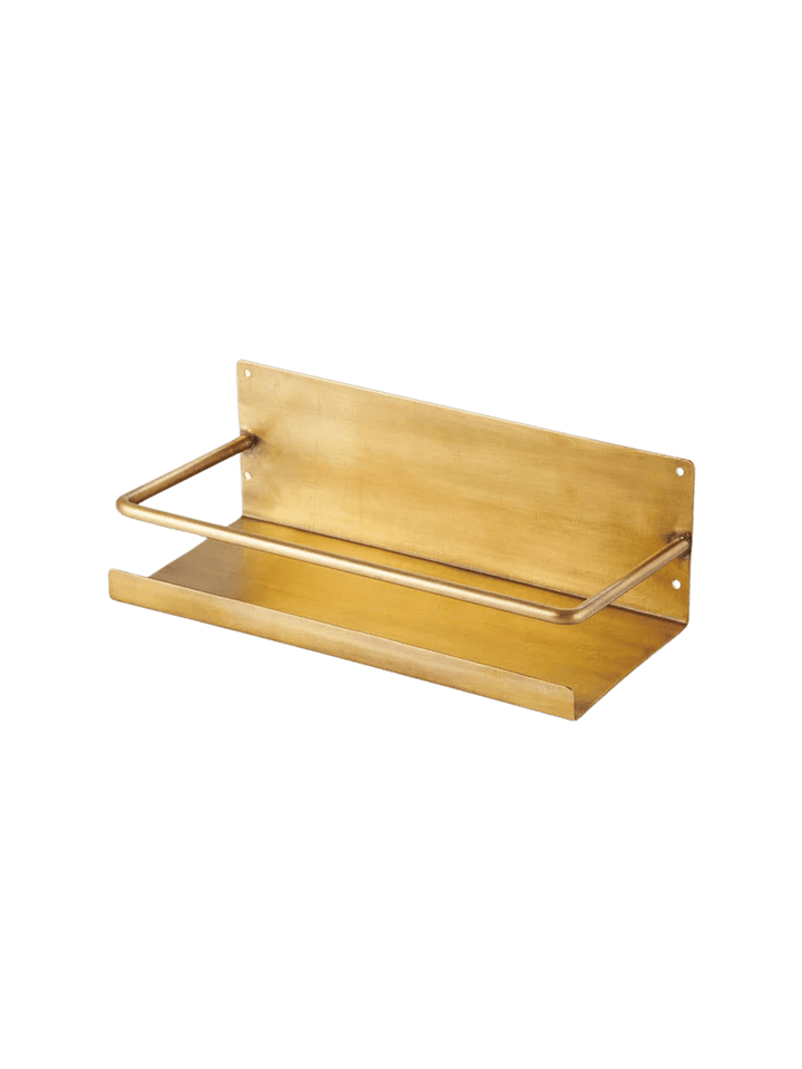 Brass Shelf from Fog Linen Work, a minimalist wall-mounted organizer featuring a protective front rail and an elegant aged brass finish | Twentyseven Toronto