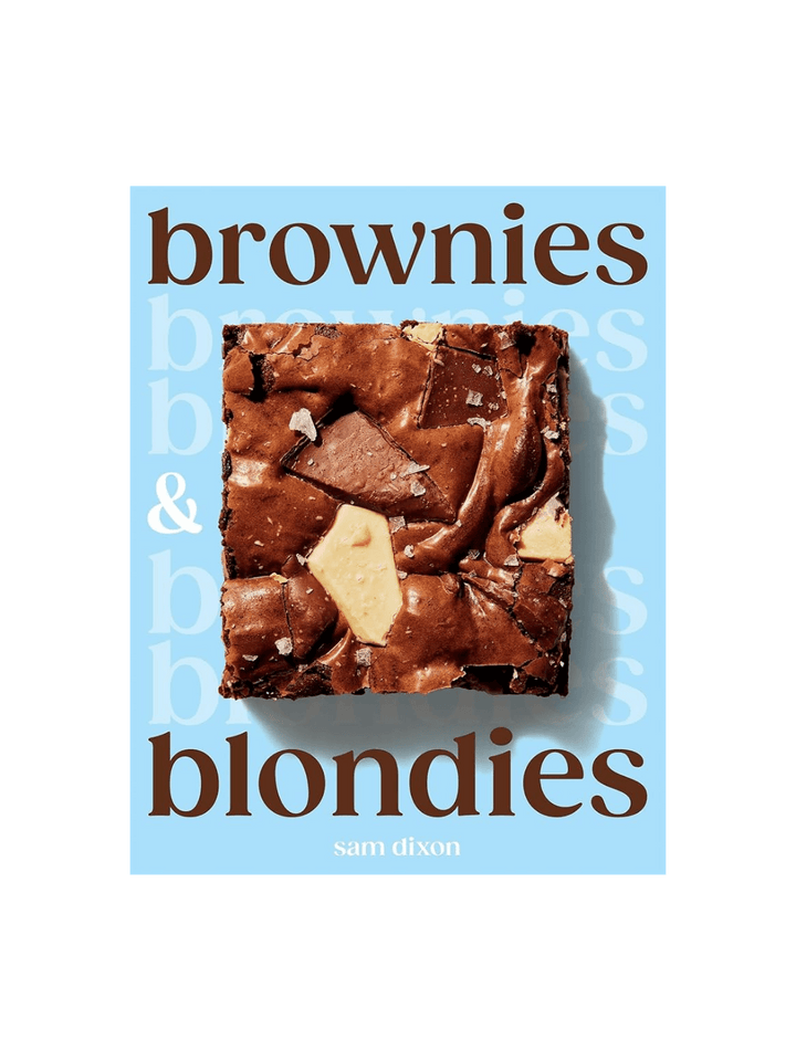 "Brownies & blondies" cookbook cover against a transparent background with blue cover design and the central brownie photograph | Twentyseven Toronto