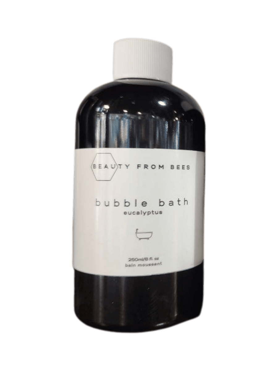 Bottle of Beauty from Bees bubble bath in Eucalyptus labeled 'Beauty from Bees' on a transparent background | Twentyseven Toronto