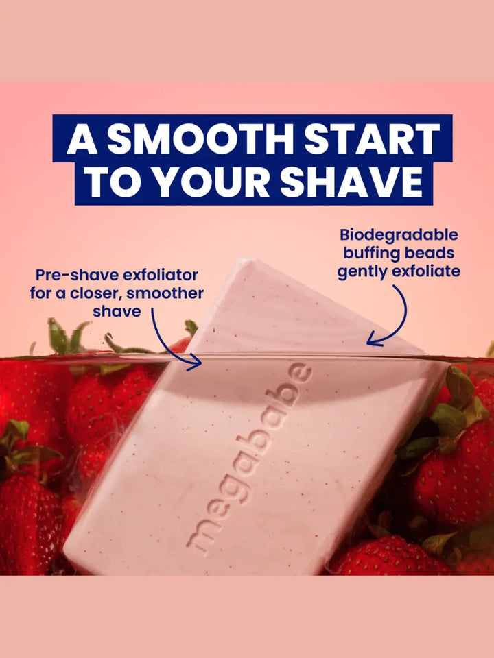 Pre-shave exfoliator 'Bumpy Bar' soap bar from Megababe with strawberries on a pink background | Twentyseven Toronto