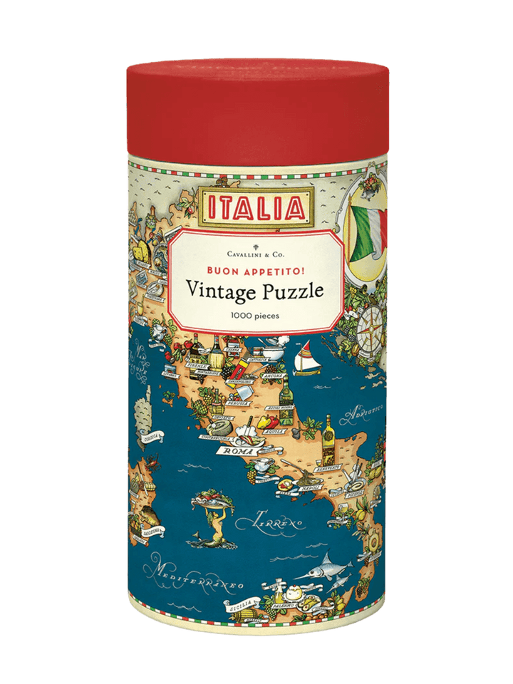 The cylindrical paper tube for the Cavallini Paper & Co Buon Appetito 1000 Piece Puzzle with a red cap, highlighting a central "Vintage Puzzle" title card above an illustrated culinary map of southern Italy | Twentyseven Toronto