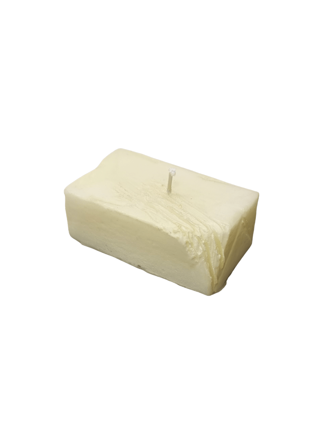 Candle in the shape of a block of butter from Cereria Introna on a transparent background | Twentyseven Toronto