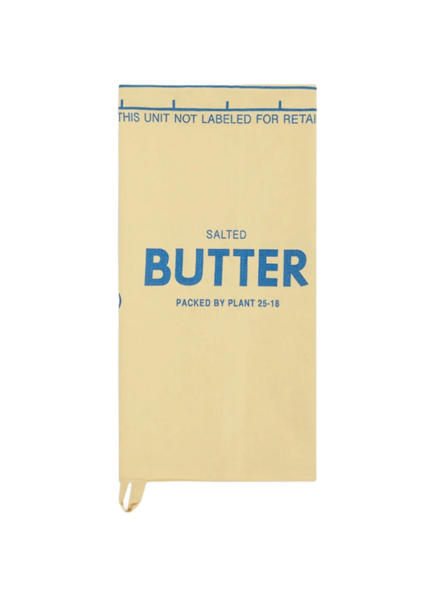 Fishs Eddy Butter Tea Towel folded to resemble a vintage salted butter wrapper in yellow and blue | Twentyseven Toronto