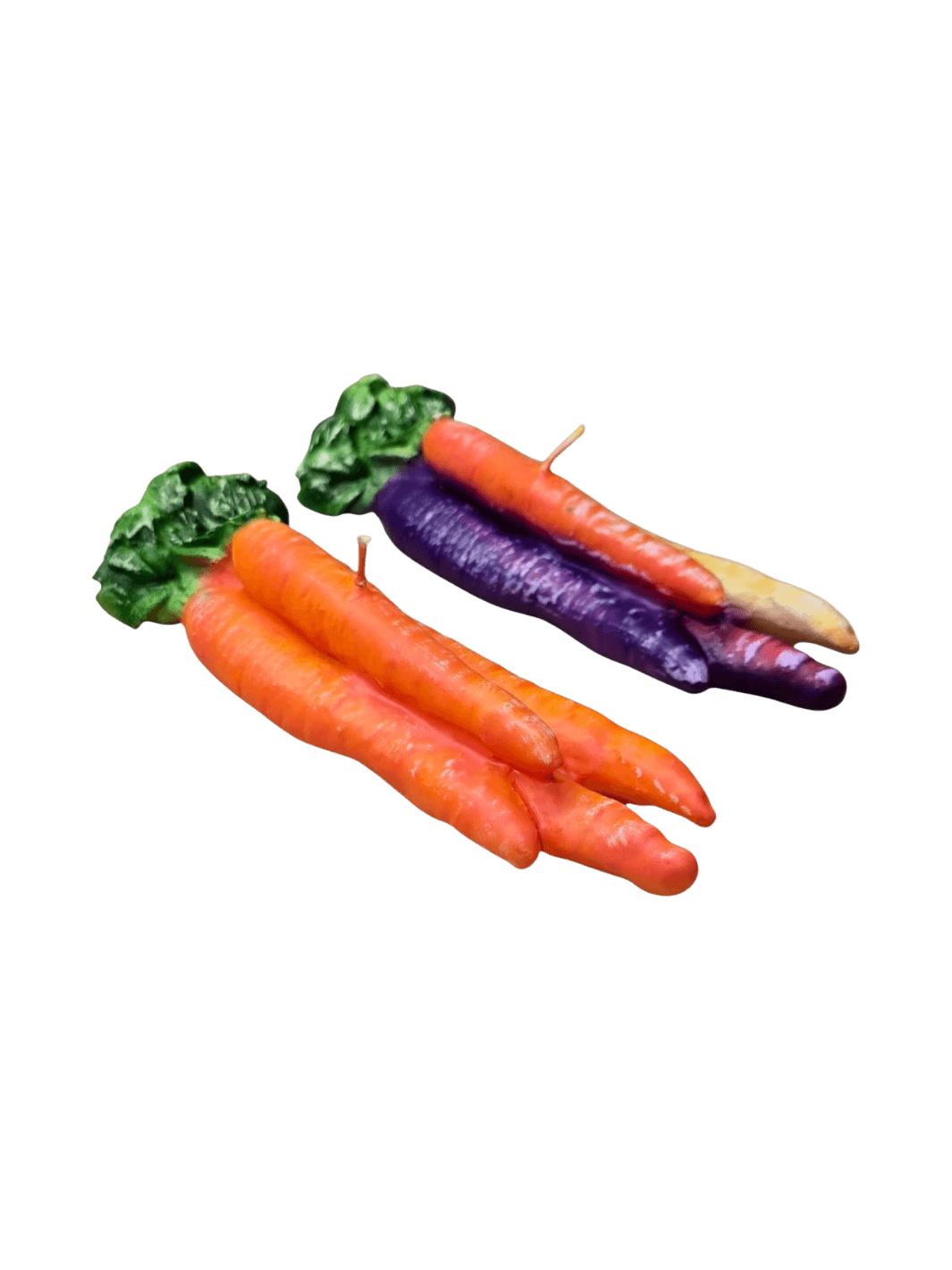 Two colourful carrot-shaped candles from Cereria Introna on a transparent background | Twentyseven Toronto