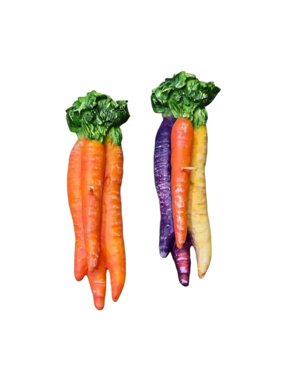 Two colourful carrot-shaped candles from Cereria Introna on a white background | Twentyseven Toronto