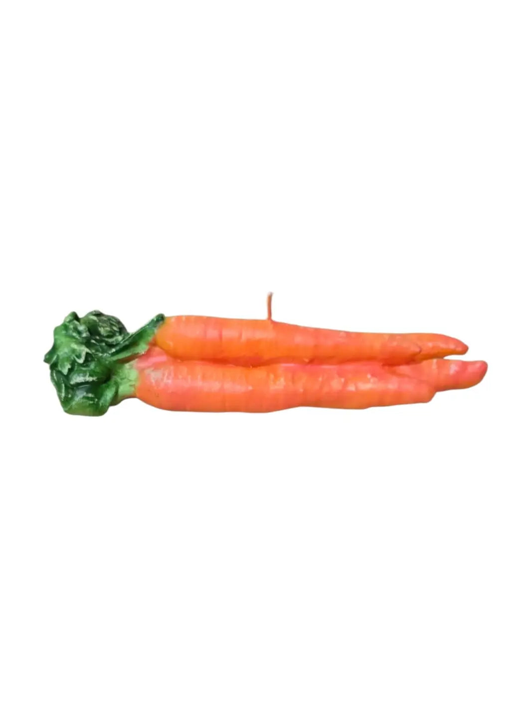 Orange carrot-shaped candles from Cereria Introna on a white background | Twentyseven Toronto