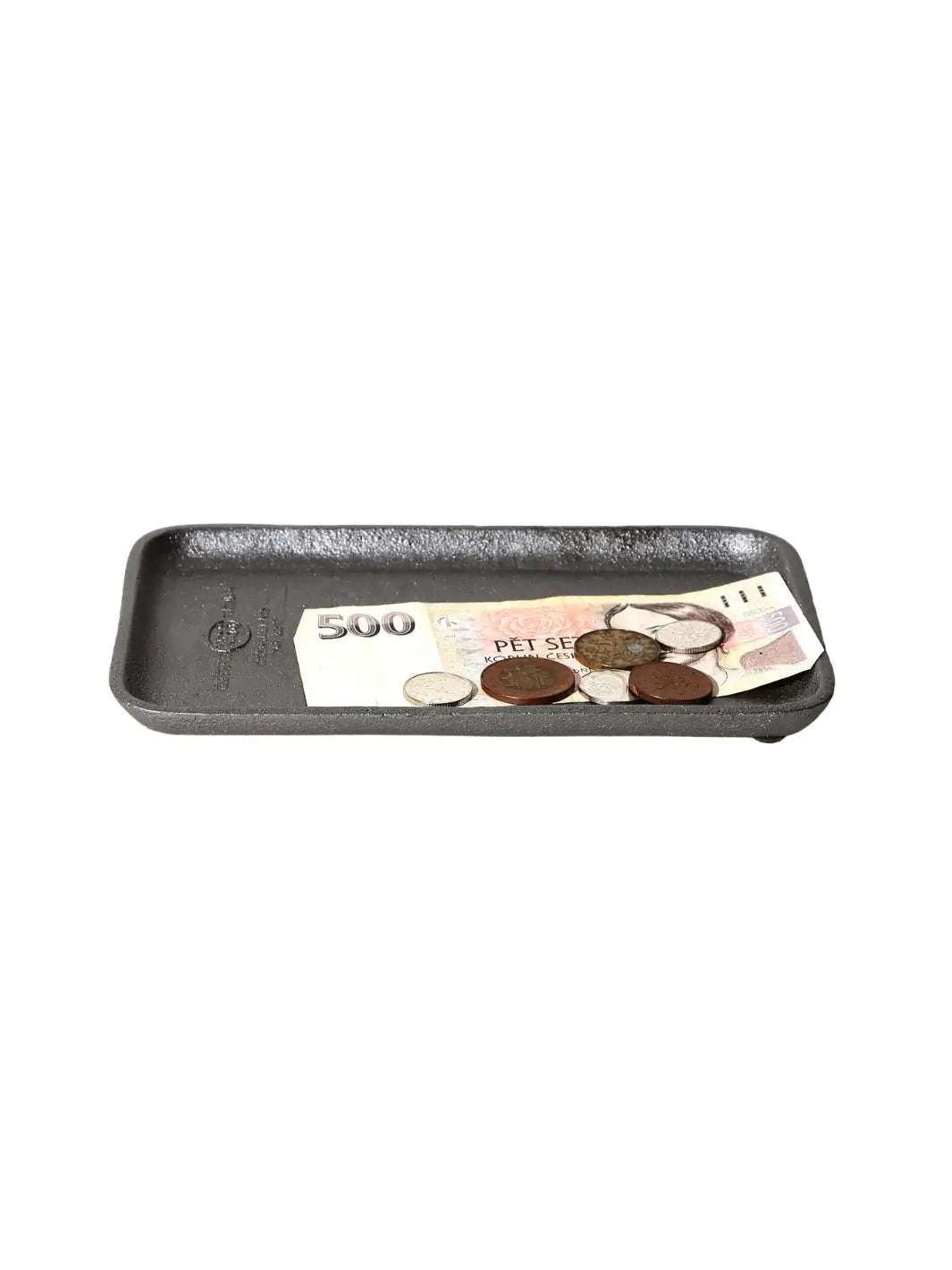 A Cast Iron Tray - Natural from Puebco with a textured grey finish is used as a coin dish, holding a 500 currency banknote and a small assortment of international loose change | Twentyseven Toronto