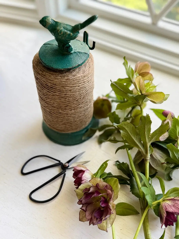 The Cast Iron Twine Dispenser with Bird Accent from Laura Hooper Design House is shown from a high angle | Twentyseven Toronto