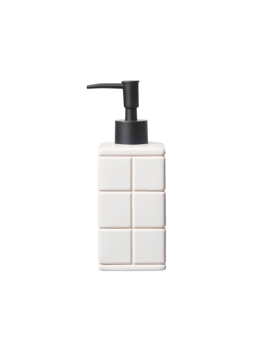 Front-facing product shot of the white Ceramic Bath Ensemble / Soap Dispenser from Puebco, showcasing its raised square tile pattern paired with a contrasting matte black pump | Twentyseven Toronto