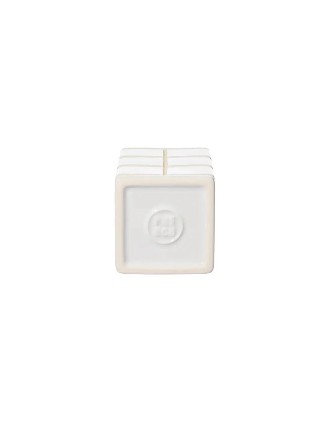 The square underside of the white Ceramic Bath Ensemble / Toothbrush Stand from Puebco, showcasing its clean edges and a circular debossed brand logo in the centre | Twentyseven Toronto
