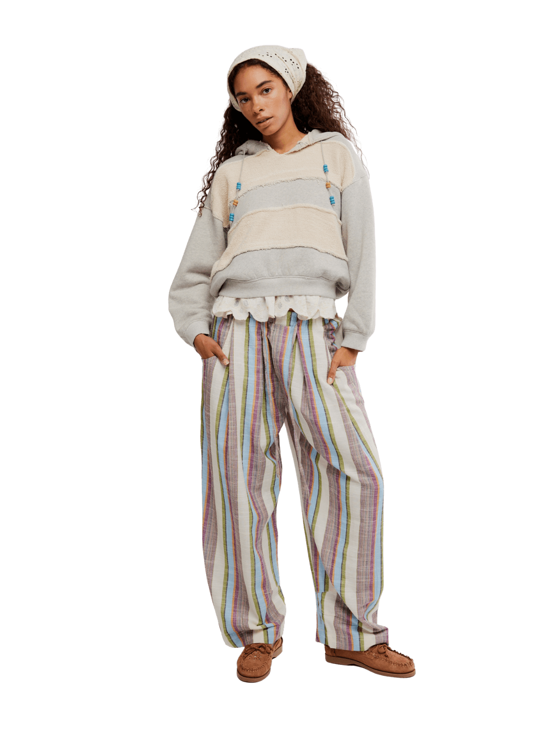 Woman wearing a light-colored hoodie and striped 'Chambers Laid Back Stripe Pants' in 'Ivory Combo' from Free People on a transparent background | Twentyseven Toronto