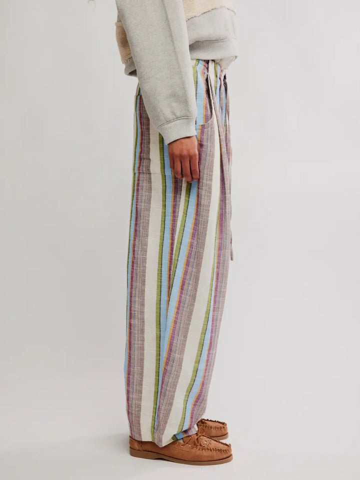 Side view image of 'Chambers Laid Back Stripe Pants' in 'Ivory Combo' from Free People on a white background | Twentyseven Toronto