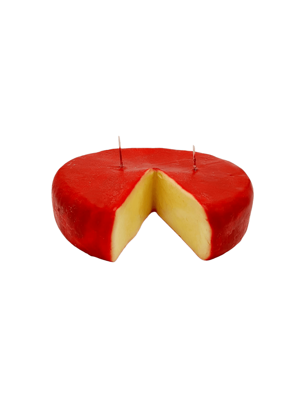 Red Edam style cheese wheel shaped candle from Cereria Introna with a wedge cut out on a transparent background | Twentyseven Toronto