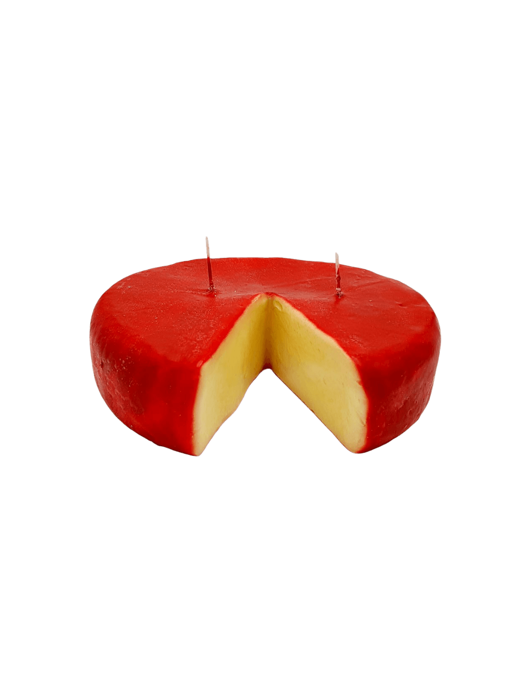 Red Edam style cheese wheel shaped candle from Cereria Introna with a wedge cut out on a transparent background | Twentyseven Toronto