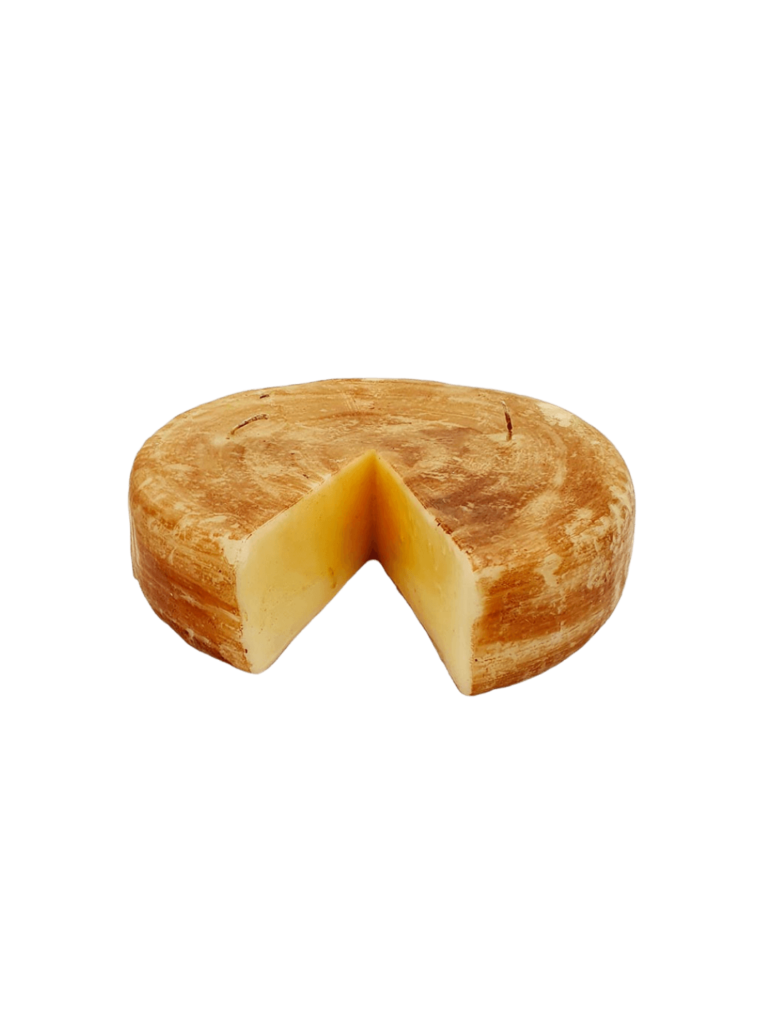 Cheese wheel shaped candle from Cereria Introna with a wedge cut out on a transparent background | Twentyseven Toronto