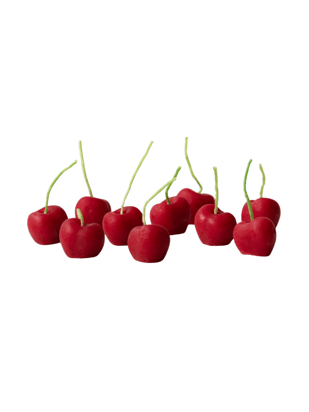 Red cherry-shaped beeswax candles from Happy Organics on a transparent background | Twentyseven Toronto