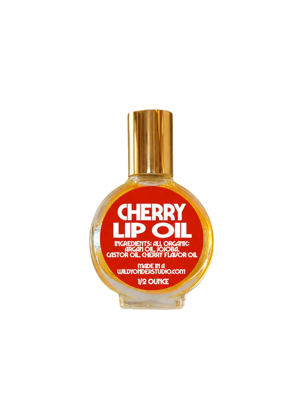 Wild Yonder Studio Cherry Lip Oil in a glass bottle with a red label and gold cap | Twentyseven Toronto