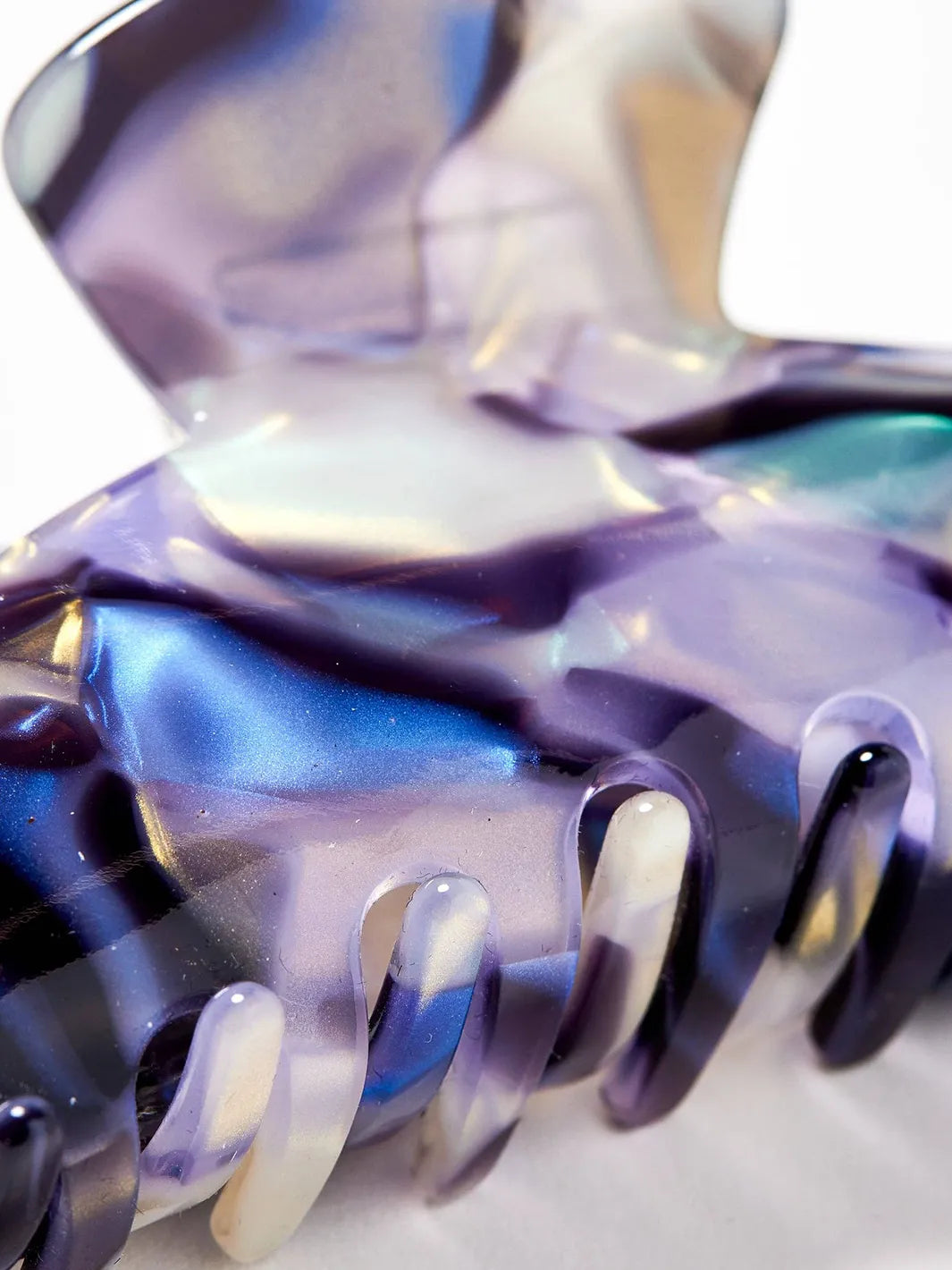 Close-up of the Chunks Baby Dolly Claw in Milk Jelly showing its glossy marbled acetate and multicolor iridescent finish | Twentyseven Toronto
