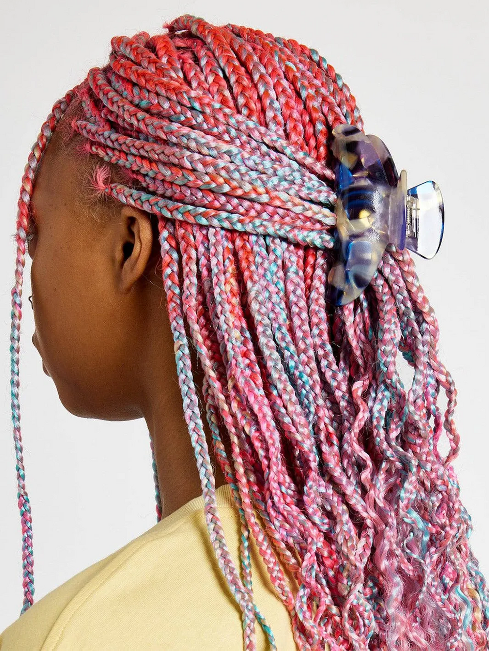 Chunks Baby Dolly Claw in Milk Jelly securing long pink and blue braids in a half-up hairstyle | Twentyseven Toronto