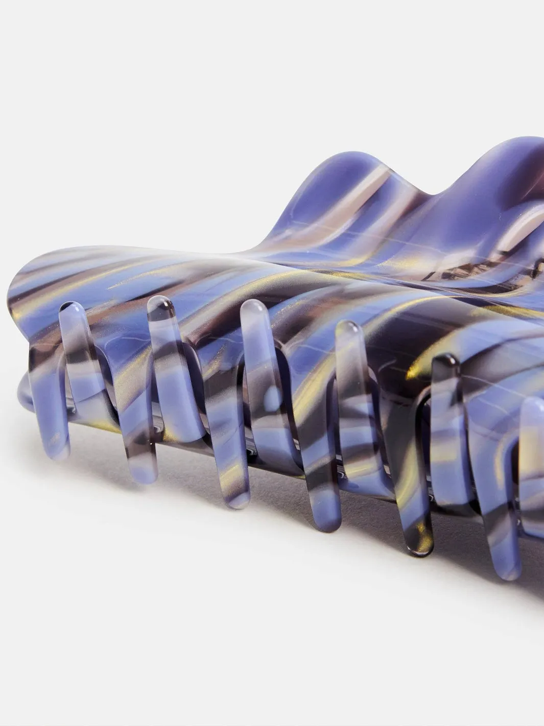 Close-up of the Chunks Nimbus Claw in Phantom showing its marbled blue and purple finish and curved teeth | Twentyseven Toronto